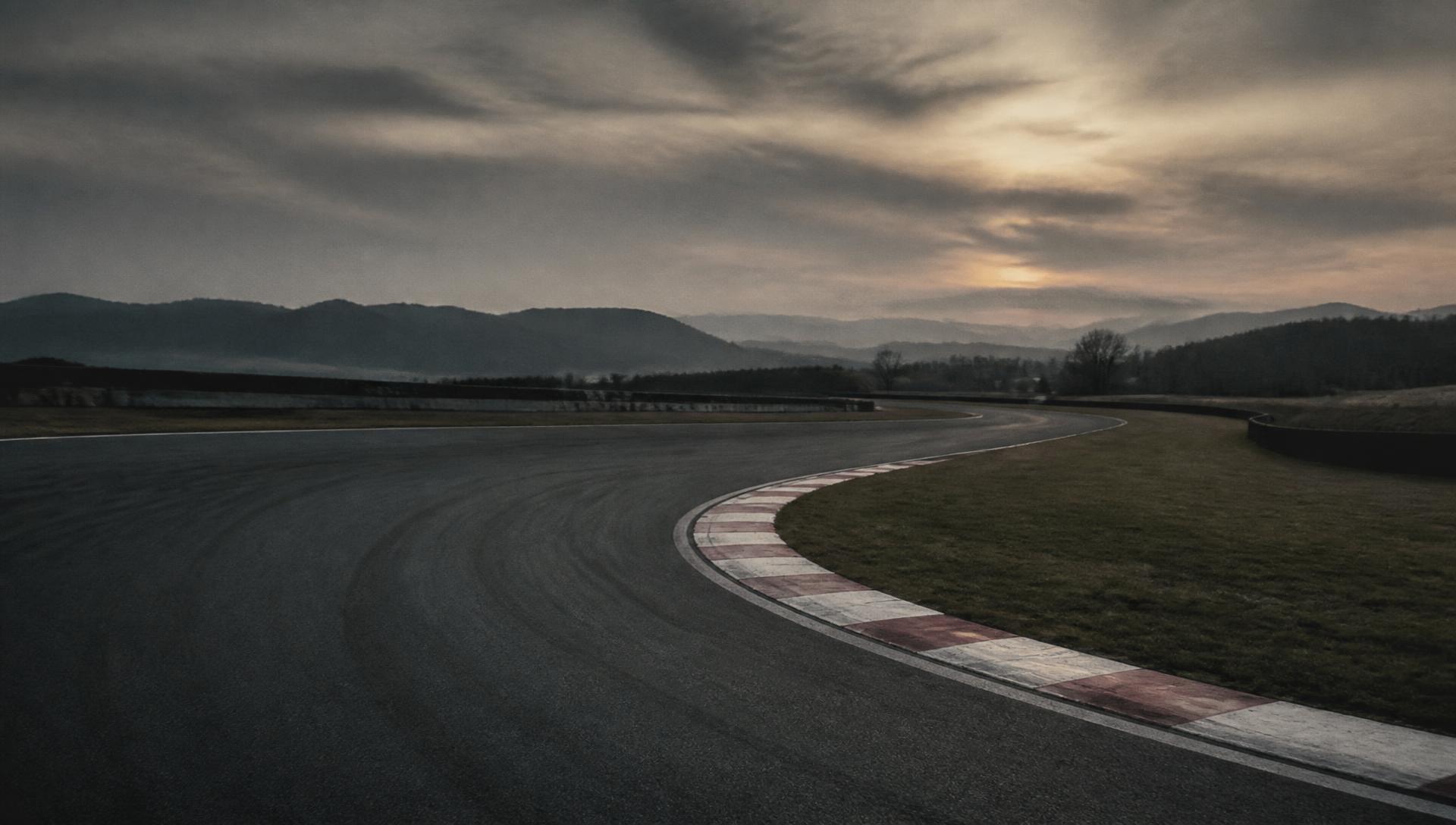 Empty racing circuit corner at dusk