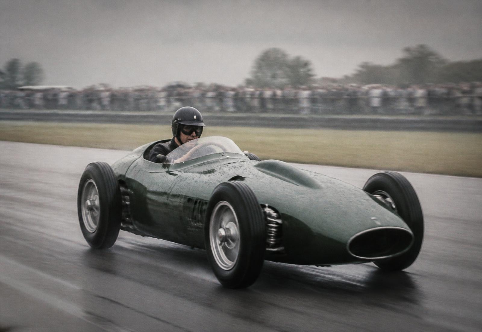 Vintage racing car on a damp circuit